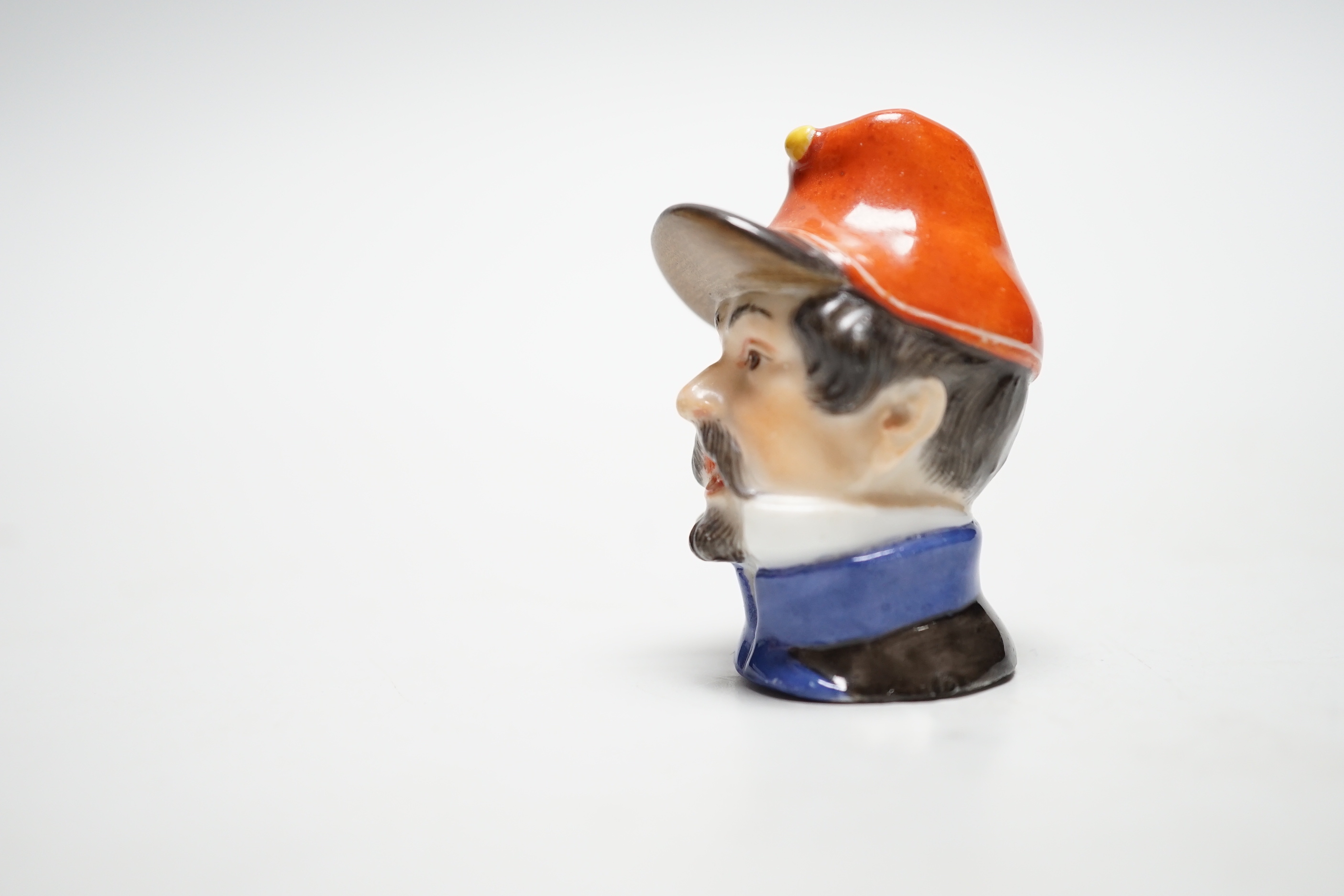 A Meissen bottle stopper or cane handle, modelled as a soldier’s head, 4.5cm